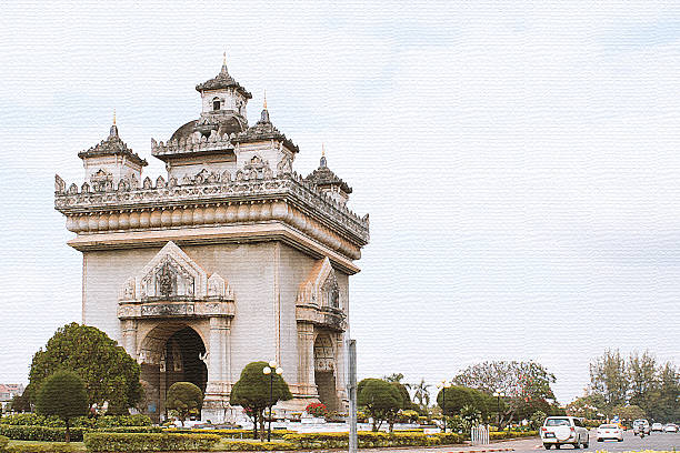 Patuxai is famous landmark and attraction of Vientiane, Laos. Patusay triumph arch in Vientian Laos - watercolor filter on paper texture. vientian stock pictures, royalty-free photos & images