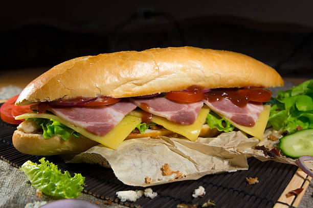 istock Long sandwich with meat, vegetables and barbecue sauce 488469762