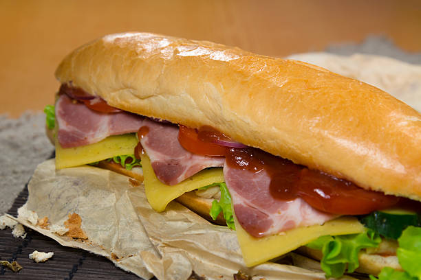 istock Long sandwich with meat, vegetables and barbecue sauce 488469824