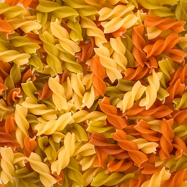 Pasta Fusilli colorata texture background