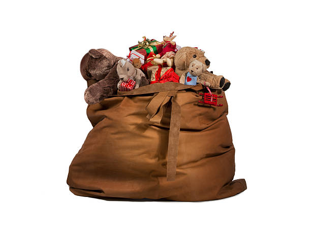 Santa Claus gift bag full of toys and gifts stock photo