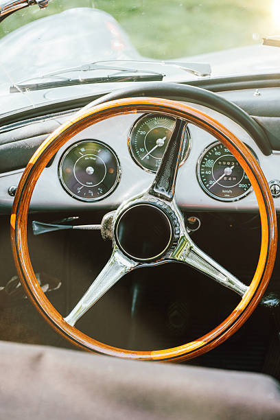 istock Vintage car interior with wooden steering wheel 488472722