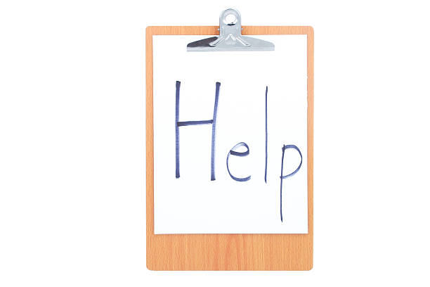 istock Wooden Clipboard with white paper and word Help 488472828