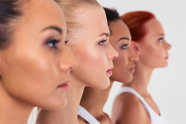 istock Four women standing in a raw 488473110