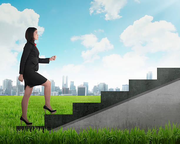istock Confident business person walking upstairs 488473120
