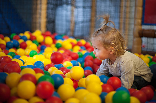 istock Baby girl in ball pool 488473257