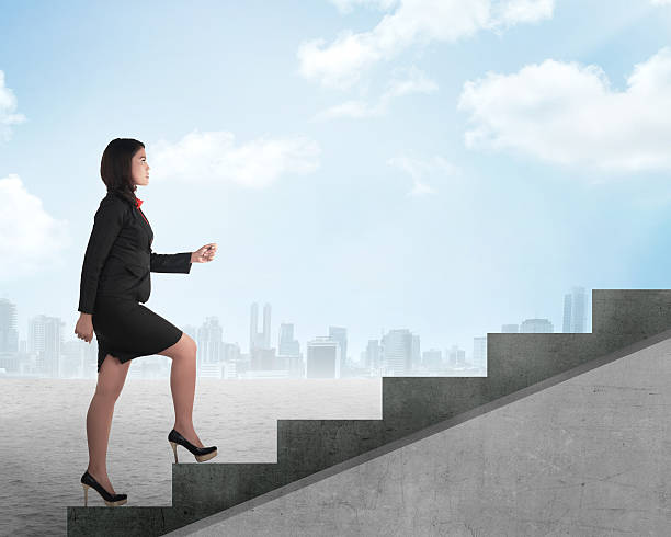 istock Confident business person walking upstairs 488473510
