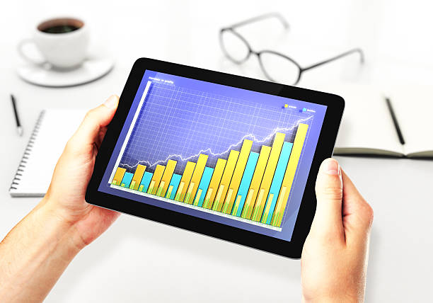 istock illustration of Financial graph on a digital tablet in office 488474194