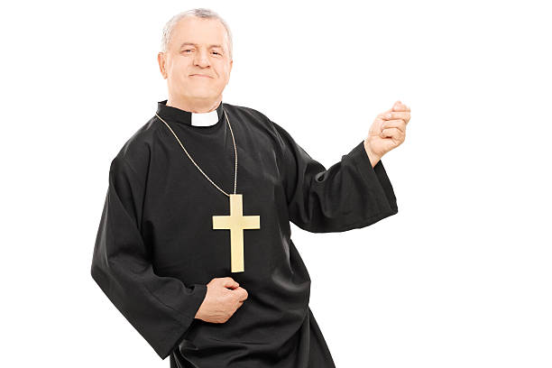 istock Happy priest playing air guitar 488474281