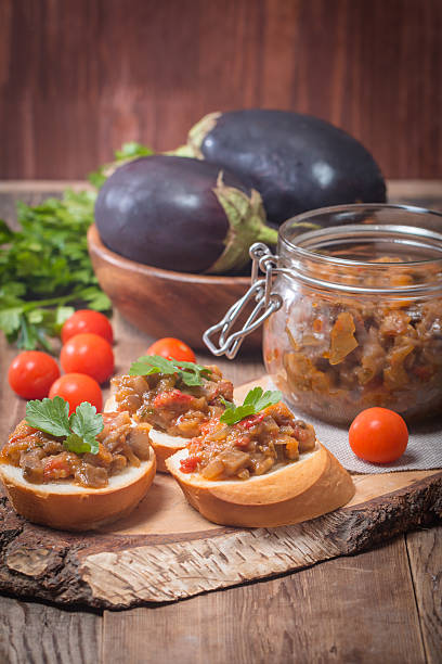 istock Eggplant caviar in a glass jar with croutons 488474318