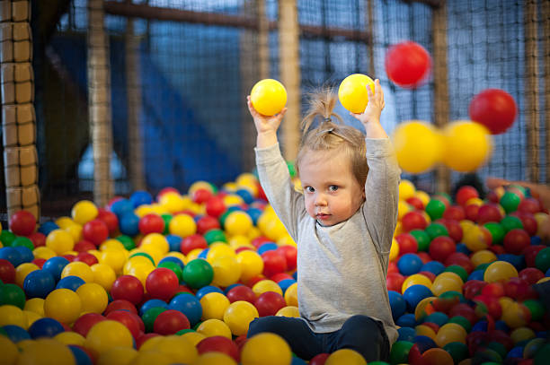 istock Baby girl in ball pool 488474835