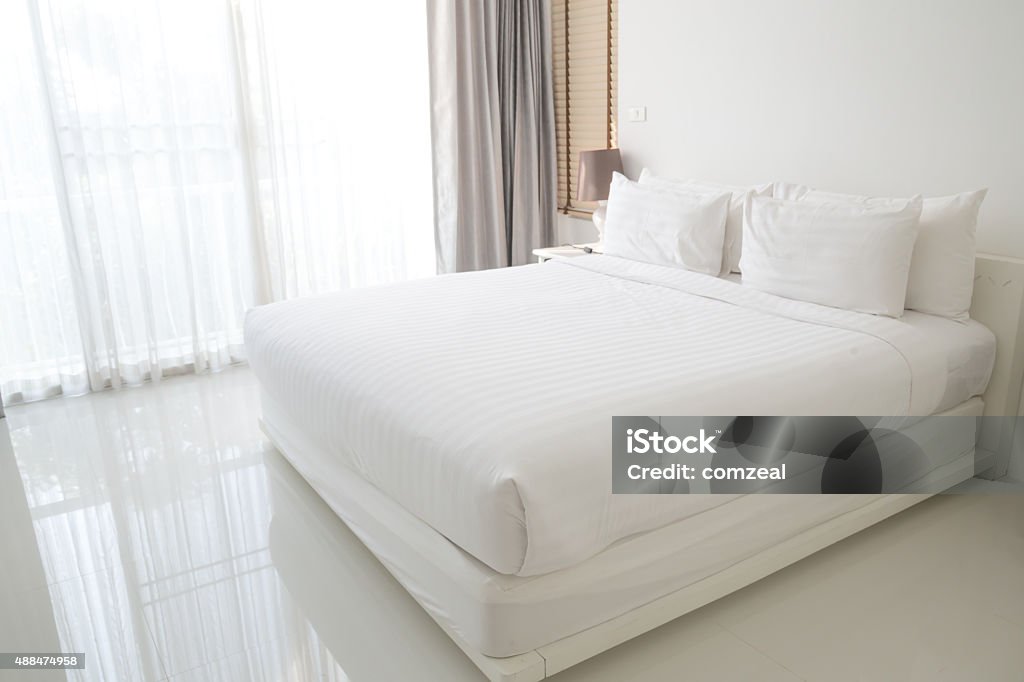 White bed sheets and pillows Bed - Furniture Stock Photo