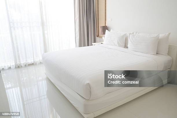 White Bed Sheets And Pillows Stock Photo - Download Image Now - Bed - Furniture, Mattress, Sheet - Bedding