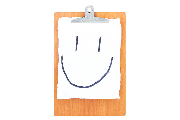 Wooden Clipboard with white rough paper and a smile face