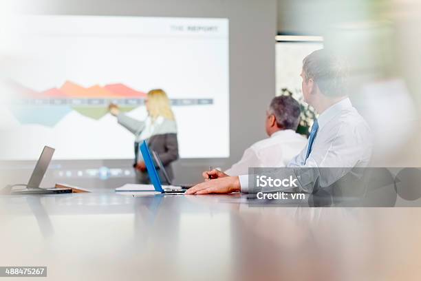 Female Executive Explaining Graph Stock Photo - Download Image Now - Adult, Analyzing, Board Room