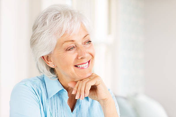 istock Contemplative Senior Woman Smiling. 488475601