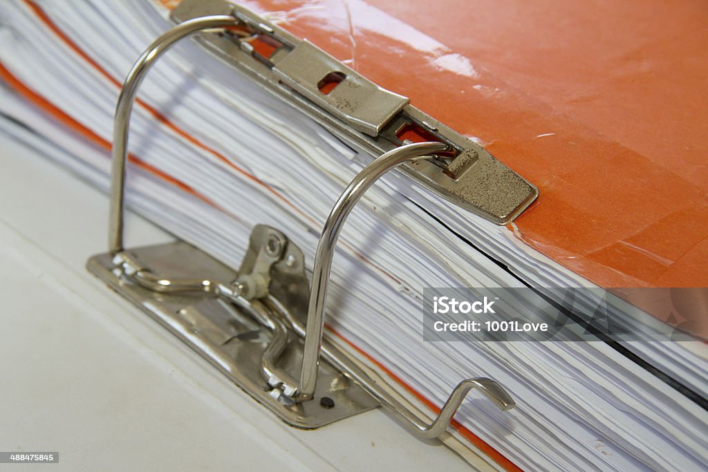 Office desk up close, cluttered with stuff Absence Stock Photo