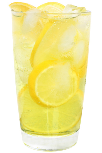 Lemonade with ice cubes on white background.