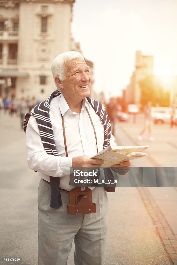 Elderly men traveling Elderly men in the European city. Active Lifestyle Stock Photo