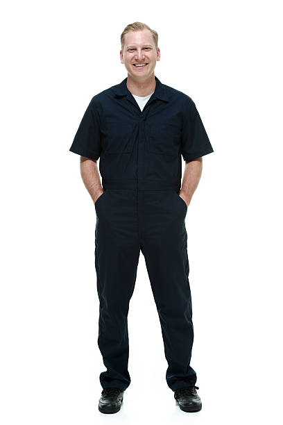 istock Smiling mechanic standing with hands in pockets 488476753