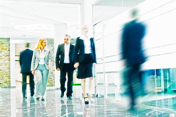 istock Businesspeople Walking in a Modern Interior 488477053