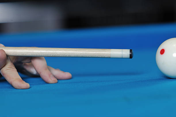 istock young man play pro billiard game 488477999