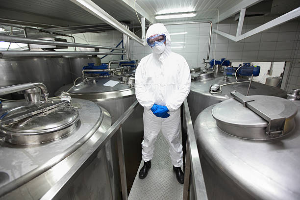 istock biotechnology specialist in protective uniform portrait 488479173