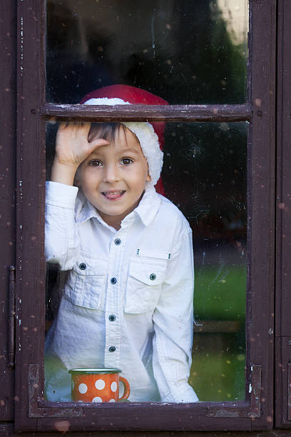 istock Cute little boy, holding cup with tea, waiting for Santa 488483044