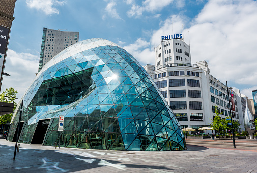 Eindhoven, Netherlands- May 24, 2015: Day view of the old Philips factory building and modern futuristic architecture in the city centre of Eindhoven. Western Europe