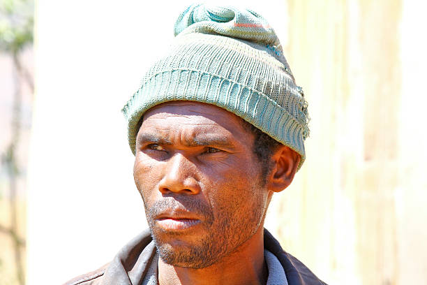 istock Poor black South African man holding his hat 488484896