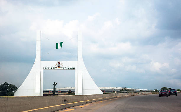 Abuja City Gate, Nigeria. Welcome sign on the road. abuja stock pictures, royalty-free photos & images