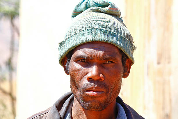 istock Poor black South African man holding his hat 488484914