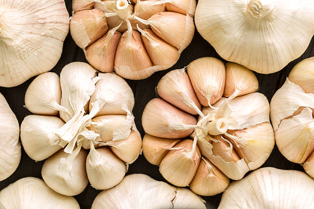 istock Garlic Background / Garlic / Garlic on Black Wooden Background 488485498