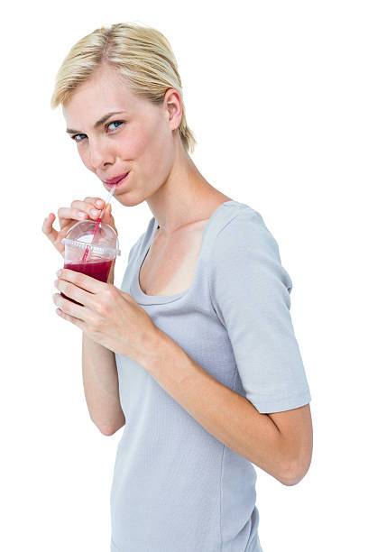 istock Attractive woman drinking healthy juice 488487608