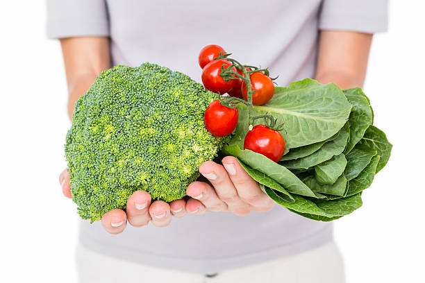 istock Woman holding vegetables 488488348