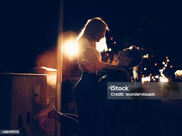 Young Couple On A Date At Night On City Street Stock Photo - Download Image Now - Night, Teenager, Adolescence