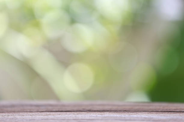 istock wood floor and colorful bokeh. 488492590