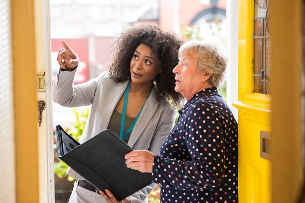 istock saleswoman  pointing out work to householder 488493214