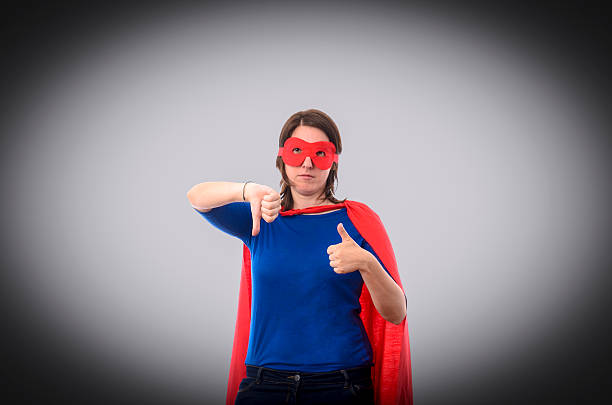 istock Woman superhero with red cape 488493402