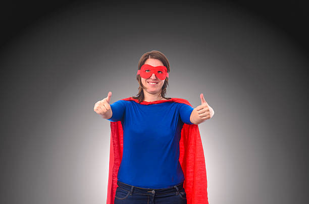 istock Woman superhero with red cape 488493512