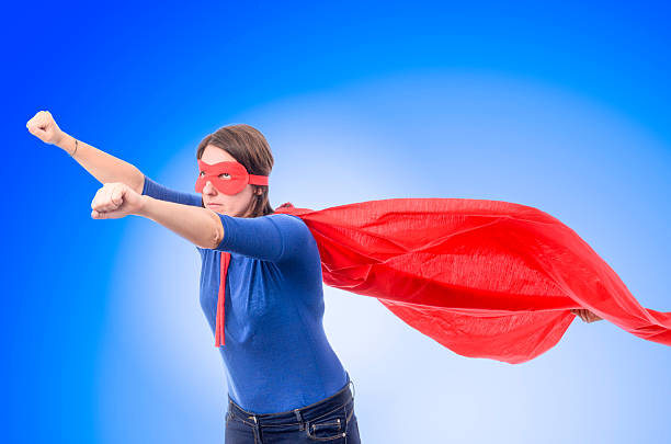 istock Woman superhero with red cape. 488493904