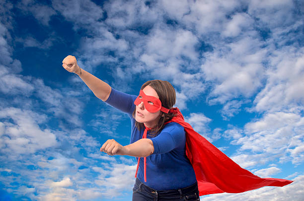 istock Woman superhero with red cape. 488494236