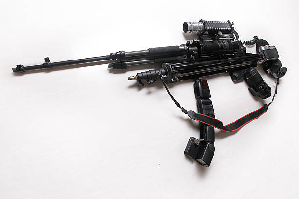 istock camera with lens and other photo equipment, camera gun, weapons 488495672