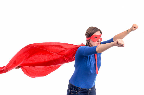 istock Woman superhero with red cape 488496256