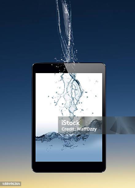 Water Splashing Tablet Stock Photo - Download Image Now - 2015, Abstract, Backgrounds