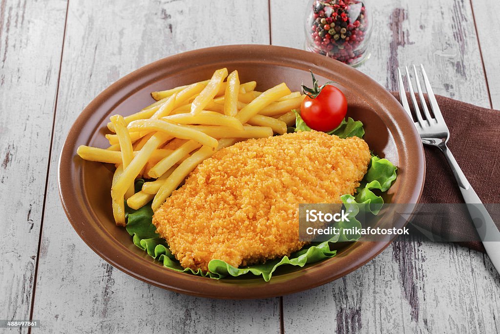 breaded chicken schnitzel fries Chicken Meat Stock Photo