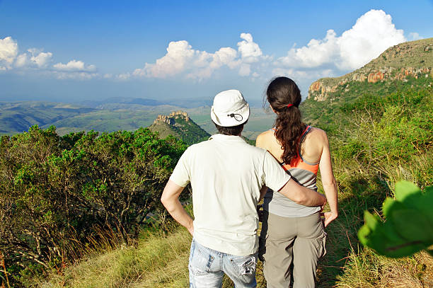 istock Happy couple hiking in mountains 488498245
