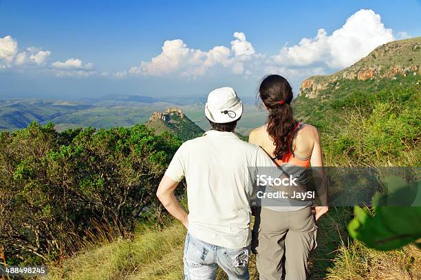 Happy Couple Hiking In Mountains Stock Photo - Download Image Now - Active Lifestyle, Activity, Adult
