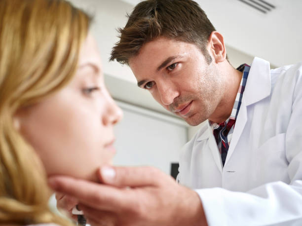 istock Doctor Examining Young Woman 488498264