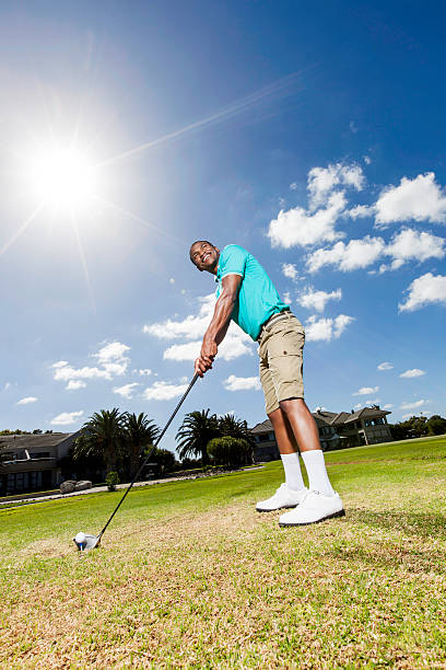 istock African golfer feeling good about his next hit 488498777